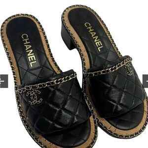 CHANEL Black Quilted Mules with Chain Accent